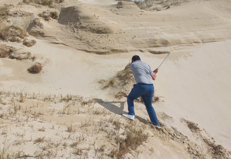 Man playing golf